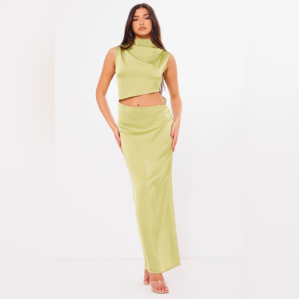 Cream satin high neck, cut out maxi dress. The color of the dress is cream.